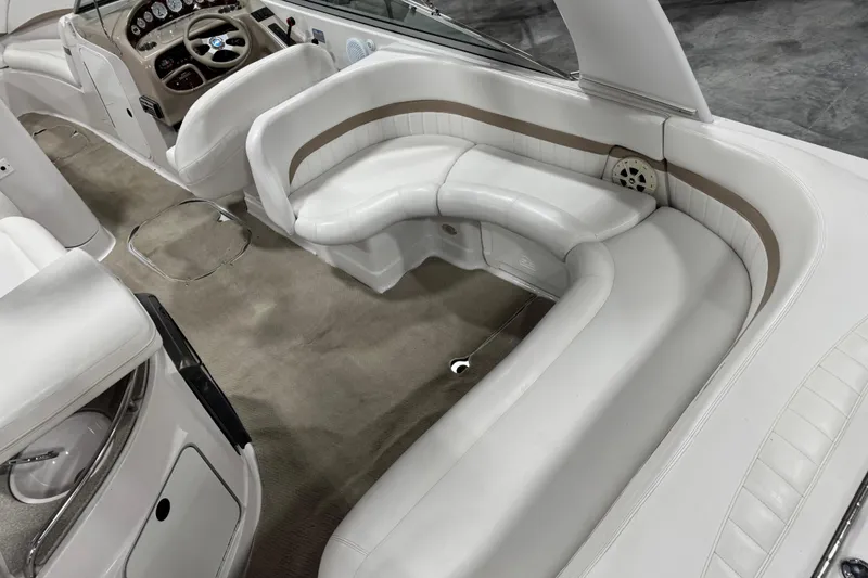 Slide: The Image of Interior of 2005 Four Winns 290 Horizon boat with white leather seating and dashboard. - 8