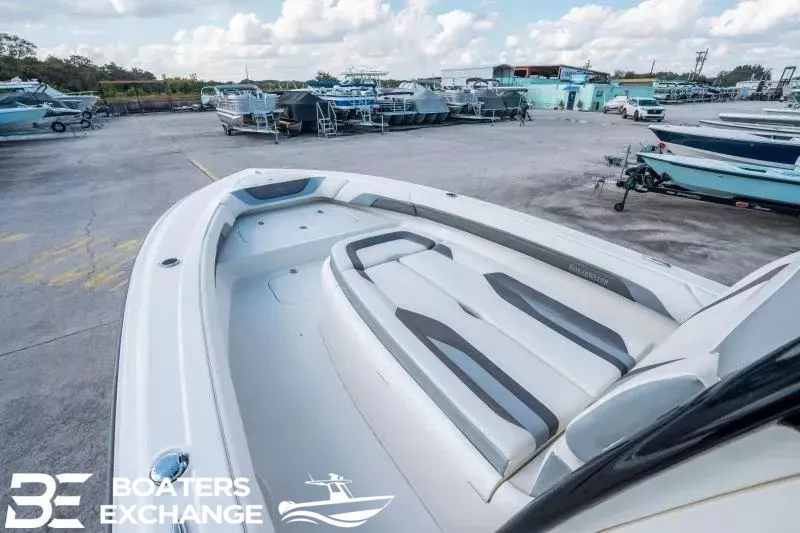 Slide: The Image of 2023 ShearWater 270 SS Carolina boat on a parking lot. - 16