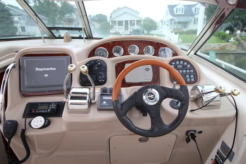 Slide: The Image of Helm of 2005 Sea Ray 340 Sundancer with Raymarine navigation system and control panel. - 11