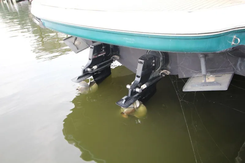 Slide: The Image of 2005 Sea Ray 340 Sundancer boat stern with dual propellers in water. - 22