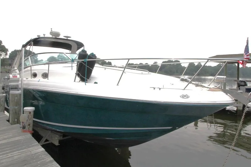 Slide: The Image of 2005 Sea Ray 340 Sundancer docked on a calm lake. - 5