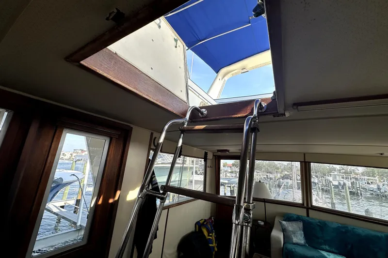 Slide: The Image of Interior view of 1985 Chris-Craft 500 Constellation yacht with open hatch and ladder. - 102