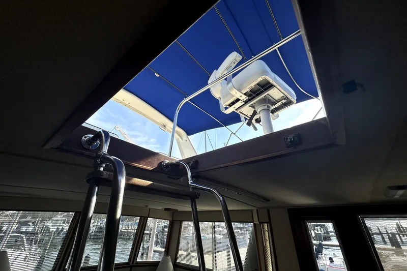 Slide: The Image of Interior view of 1985 Chris-Craft 500 Constellation yacht with open hatch and blue canopy. - 104