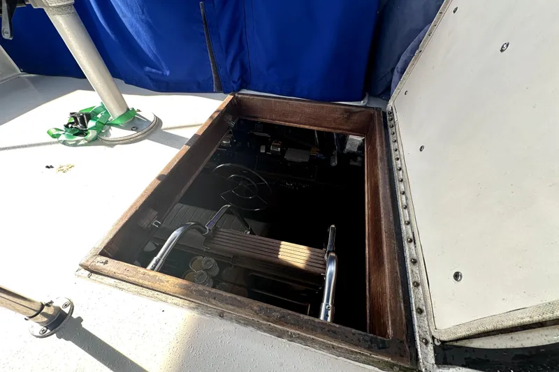 Slide: The Image of Open hatch on 1985 Chris-Craft 500 Constellation boat, revealing interior access. - 106