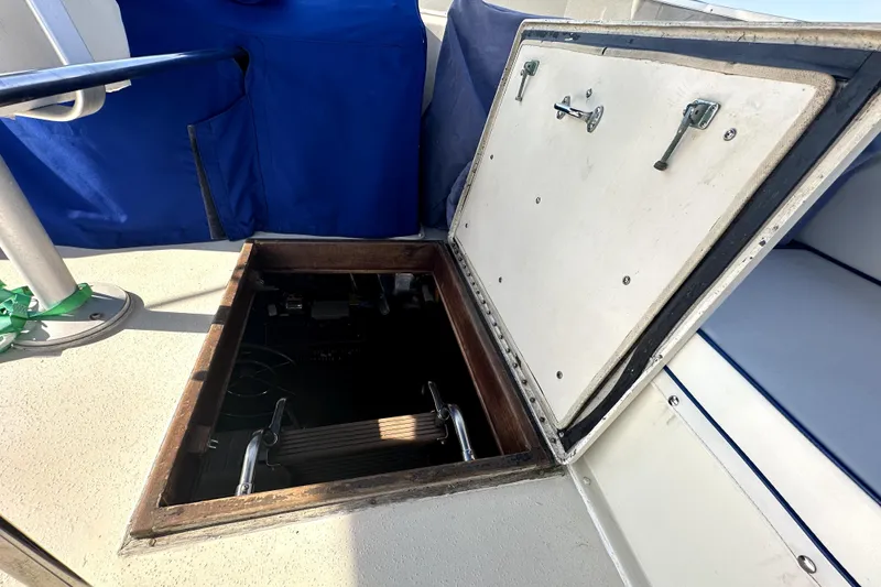 Slide: The Image of Open hatch on 1985 Chris-Craft 500 Constellation boat deck, revealing interior access. - 107