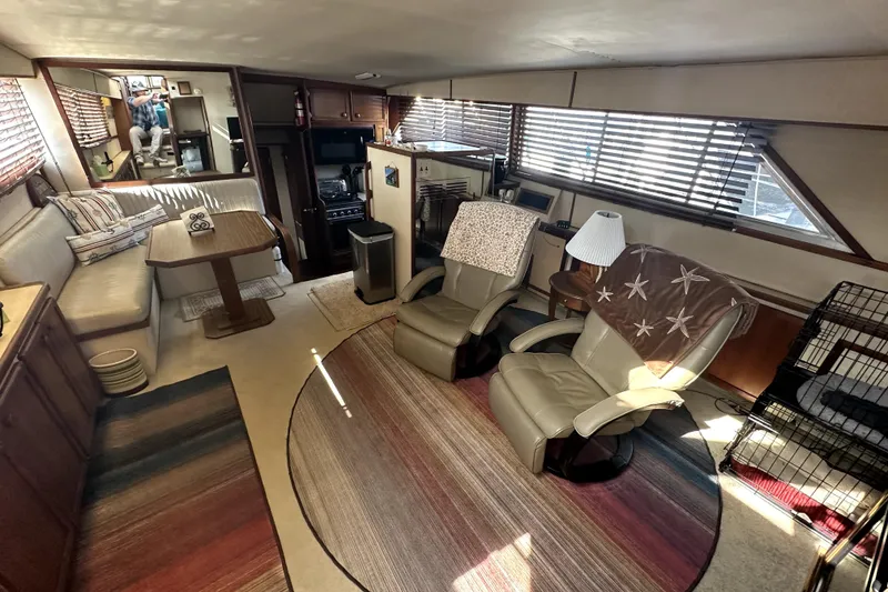 Slide: The Image of Interior of 1985 Chris-Craft 500 Constellation yacht with cozy seating and wooden accents. - 15