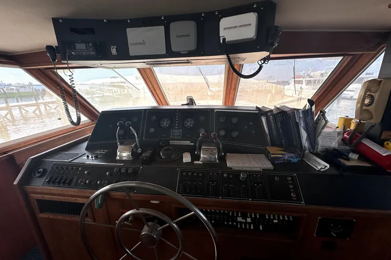 Slide: The Image of 1985 Chris-Craft 500 Constellation yacht helm with navigation equipment and controls. - 2