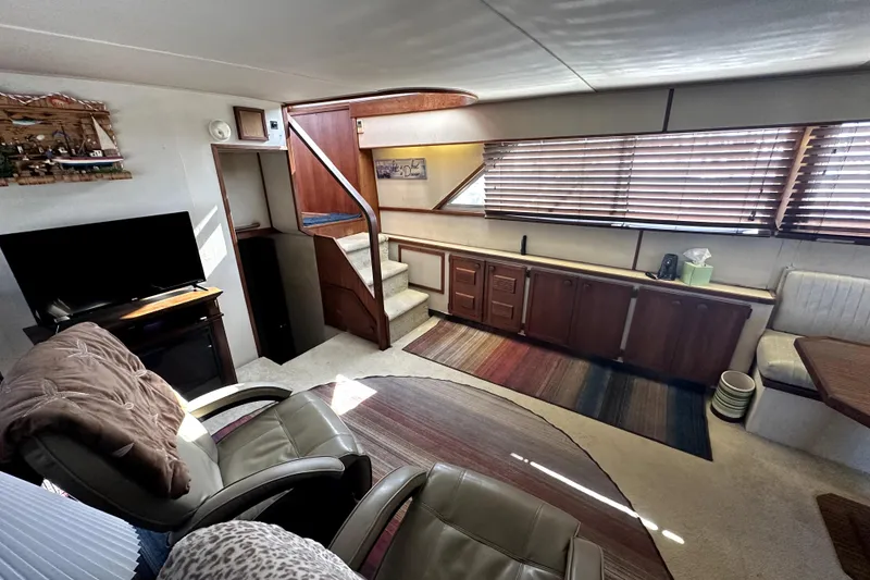 Slide: The Image of Interior of 1985 Chris-Craft 500 Constellation yacht with cozy seating and wooden cabinetry. - 20