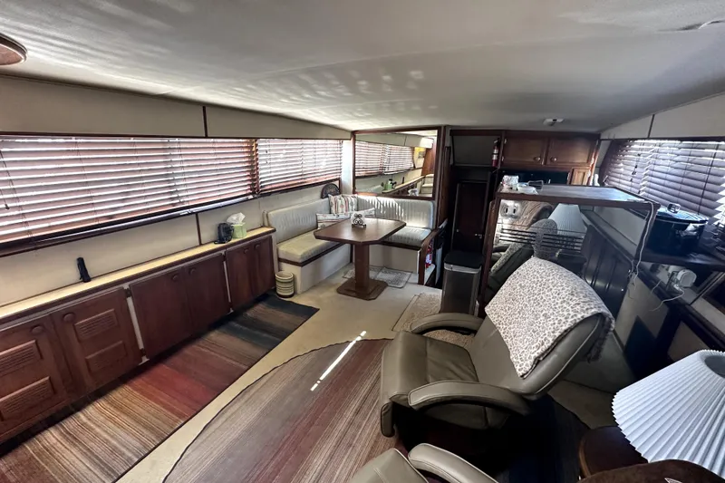 Slide: The Image of Interior of 1985 Chris-Craft 500 Constellation yacht with cozy seating and wooden accents. - 21