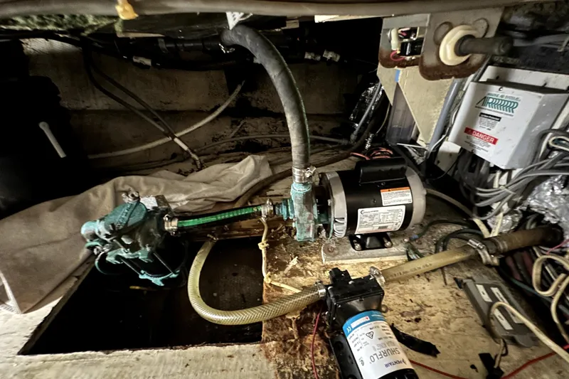 Slide: The Image of Engine room of 1985 Chris-Craft 500 Constellation with visible machinery and wiring. - 26