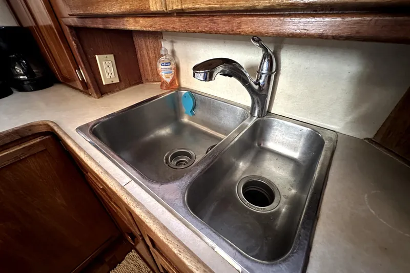 Slide: The Image of Dual stainless steel sink in 1985 Chris-Craft 500 Constellation yacht kitchen. - 35