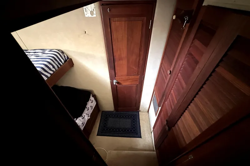 Slide: The Image of Interior of 1985 Chris-Craft 500 Constellation yacht with wooden door and bunk bed. - 38