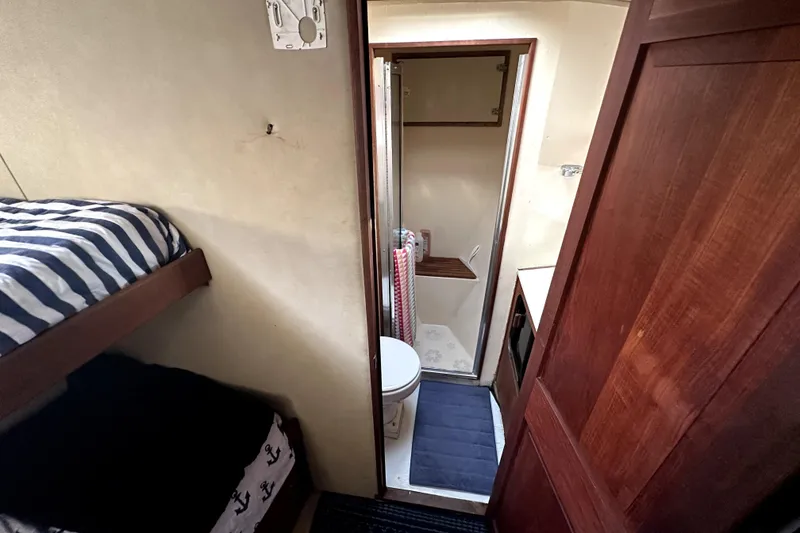 Slide: The Image of Interior of 1985 Chris-Craft 500 Constellation with bunk beds and compact bathroom. - 39