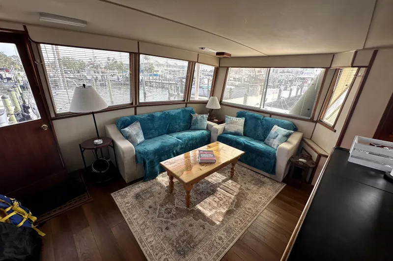 Slide: The Image of Luxurious 1985 Chris-Craft 500 Constellation yacht interior with cozy seating and elegant decor. - 4