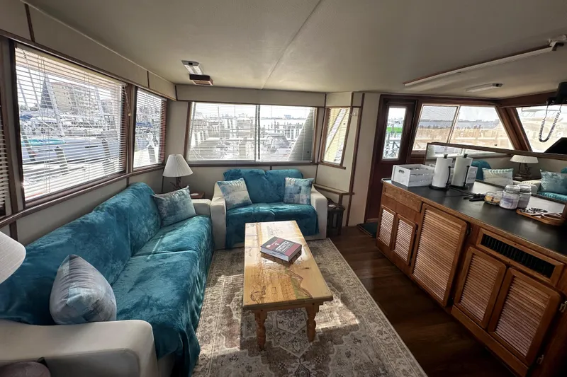 Slide: The Image of Luxurious interior of 1985 Chris-Craft 500 Constellation yacht with cozy seating and elegant decor. - 5