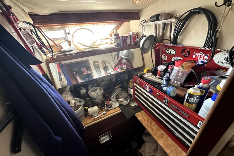 Slide: The Image of Workshop area inside a 1985 Chris-Craft 500 Constellation, featuring tools and equipment. - 52