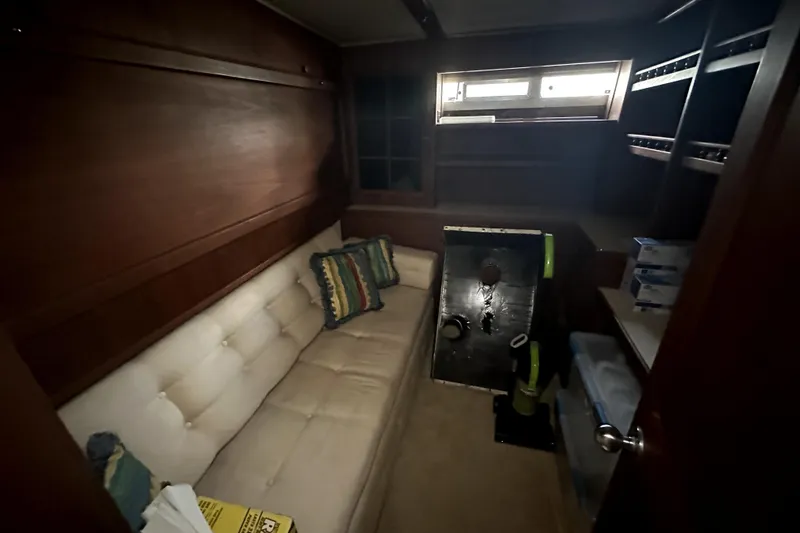 Slide: The Image of Interior of 1985 Chris-Craft 500 Constellation yacht with sofa and storage shelves. - 55