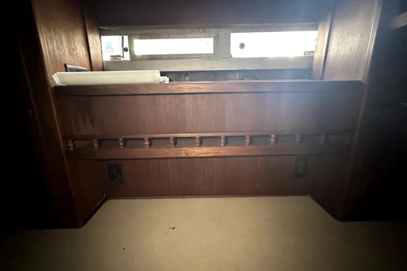 Slide: The Image of Interior of 1985 Chris-Craft 500 Constellation with wooden paneling and small window. - 58