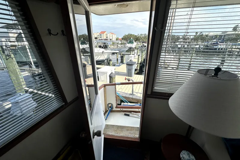 Slide: The Image of Interior view from 1985 Chris-Craft 500 Constellation yacht, overlooking marina through open door. - 6