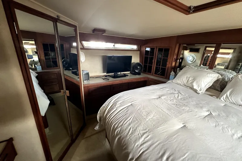 Slide: The Image of Luxurious bedroom interior of 1985 Chris-Craft 500 Constellation yacht with TV and mirrored closet. - 63
