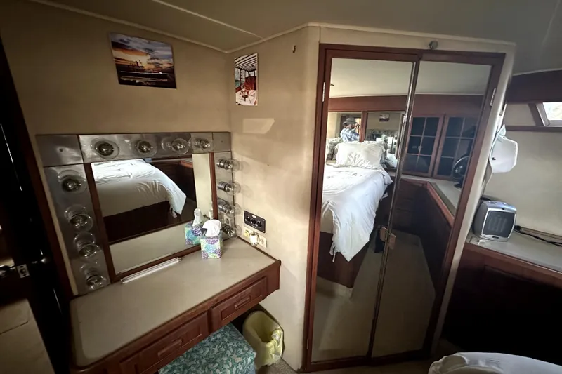 Slide: The Image of Interior of 1985 Chris-Craft 500 Constellation yacht with vanity and bedroom view. - 64