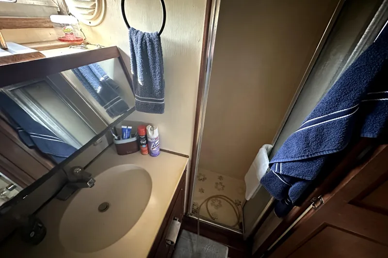 Slide: The Image of 1985 Chris-Craft 500 Constellation bathroom with sink, mirror, and shower. - 72