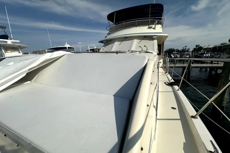 Slide: The Image of 1985 Chris-Craft 500 Constellation yacht docked at marina under clear sky. - 87