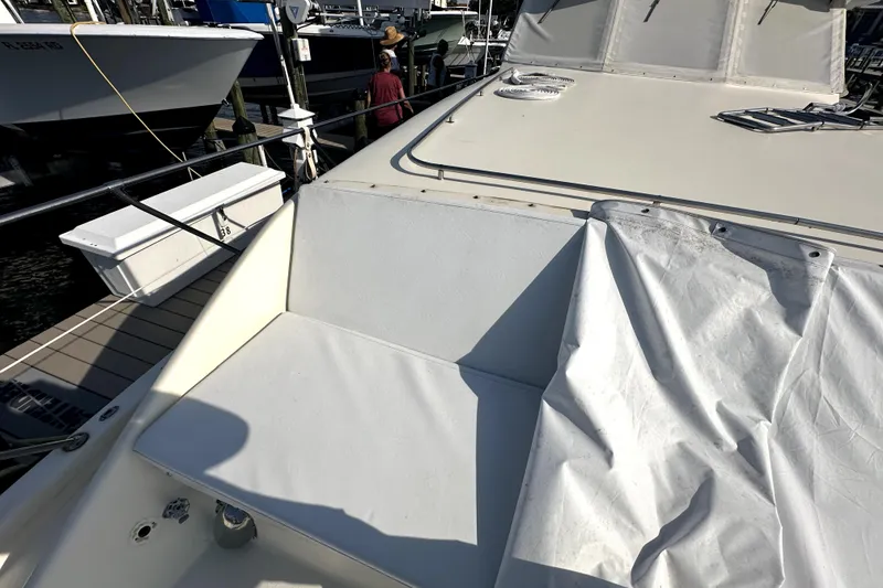 Slide: The Image of 1985 Chris-Craft 500 Constellation yacht deck with tarp, docked at marina. - 92