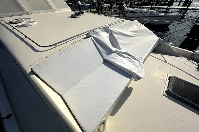 Slide: The Image of 1985 Chris-Craft 500 Constellation yacht deck with white seating and cover. - 93