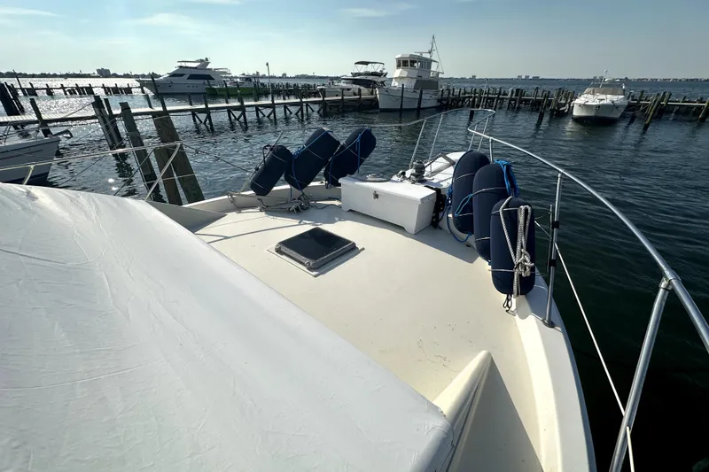 Slide: The Image of 1985 Chris-Craft 500 Constellation yacht docked at marina, sunny day. - 96