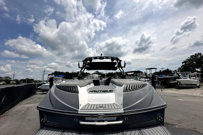 Slide: The Image of 2016 Nautique Super Air Nautique G25 Coastal Edition boat under cloudy sky. - 13