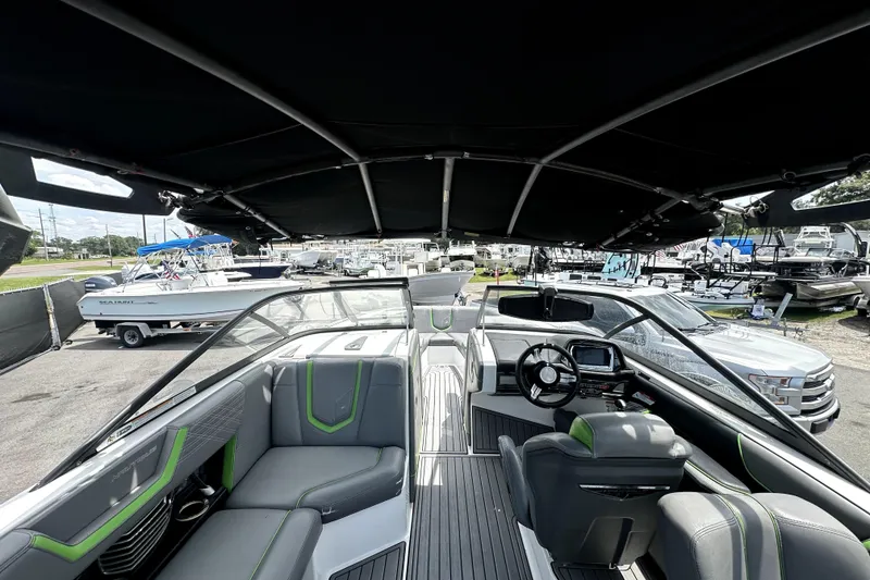 Slide: The Image of 2016 Nautique Super Air Nautique G25 Coastal Edition interior with sleek seating and modern dashboard. - 23