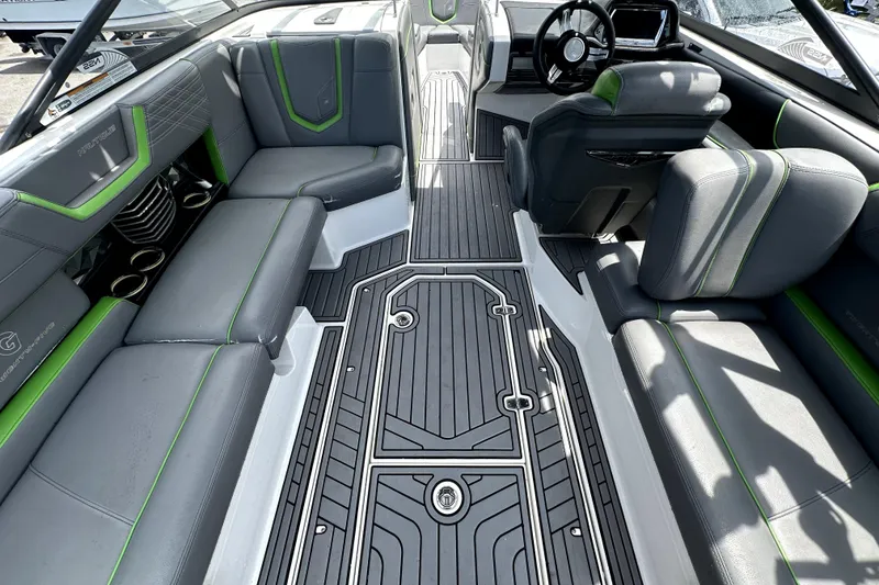 Slide: The Image of 2016 Nautique Super Air Nautique G25 Coastal Edition dashboard with steering wheel and controls. - 25