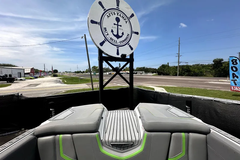 Slide: The Image of 2016 Nautique Super Air Nautique G25 Coastal Edition cockpit with steering wheel and dashboard controls. - 26