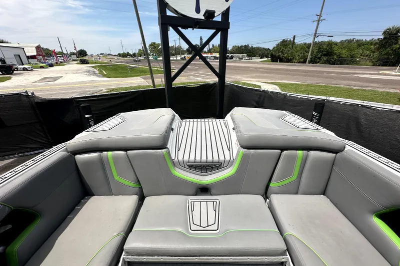 Slide: The Image of 2016 Nautique Super Air Nautique G25 Coastal Edition cockpit with modern steering and seating. - 27