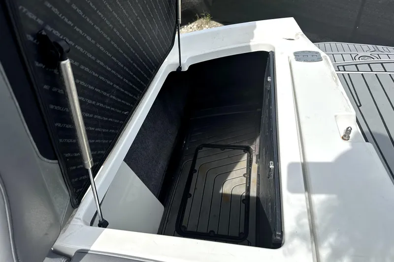 Slide: The Image of 2016 Nautique Super Air Nautique G25 Coastal Edition interior with gray and green accents. - 29