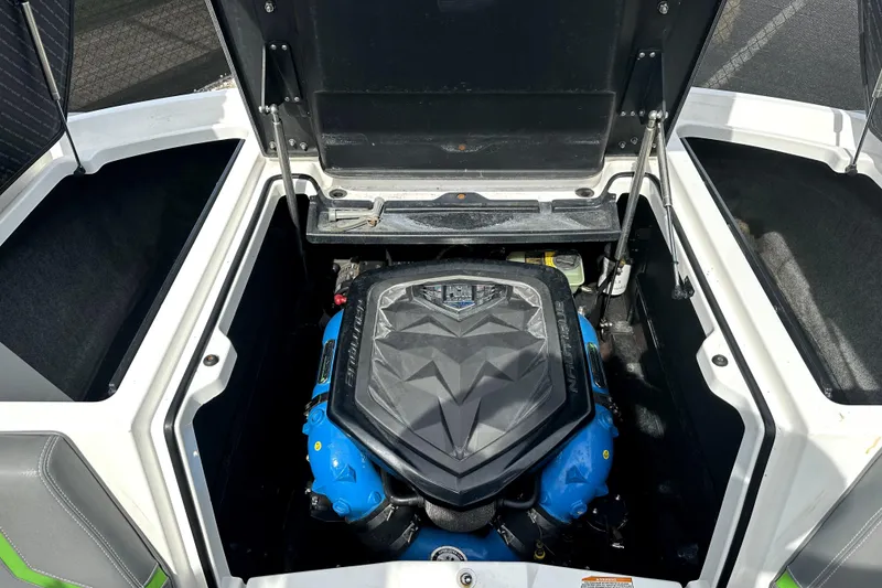 Slide: The Image of 2016 Nautique Super Air Nautique G25 Coastal Edition interior with gray and green seating. - 30