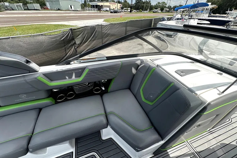 Slide: The Image of 2016 Nautique Super Air Nautique G25 Coastal Edition interior with gray and green seating. - 39