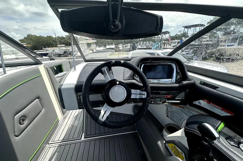 Slide: The Image of 2016 Nautique Super Air Nautique G25 Coastal Edition interior with gray and green seating. - 46