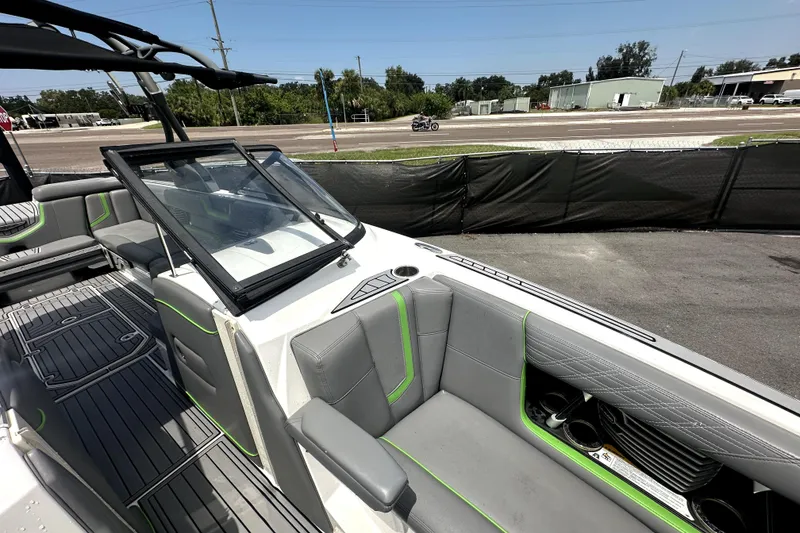 Slide: The Image of Open storage compartment on 2016 Nautique Super Air Nautique G25 Coastal Edition boat. - 60