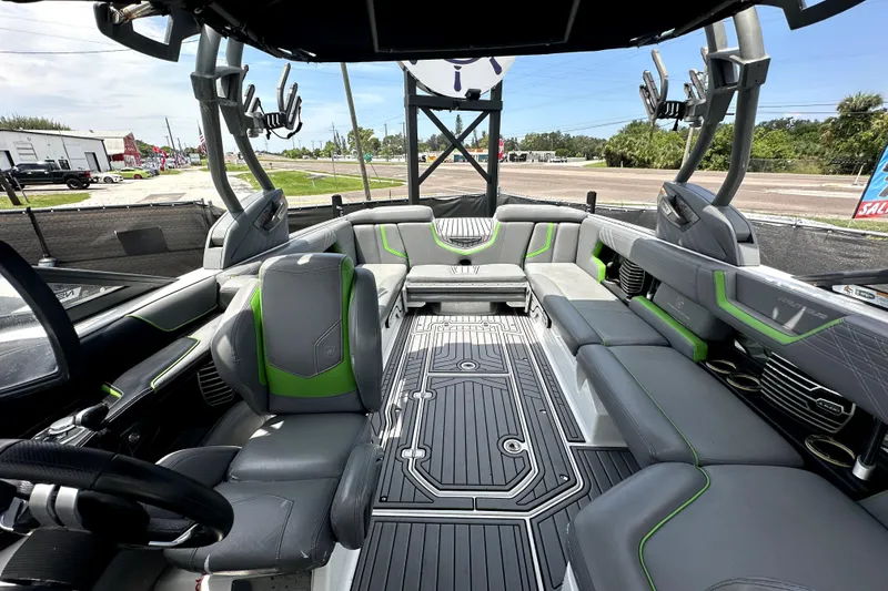 Slide: The Image of 2016 Nautique Super Air Nautique G25 Coastal Edition storage compartment open, showcasing interior space. - 62