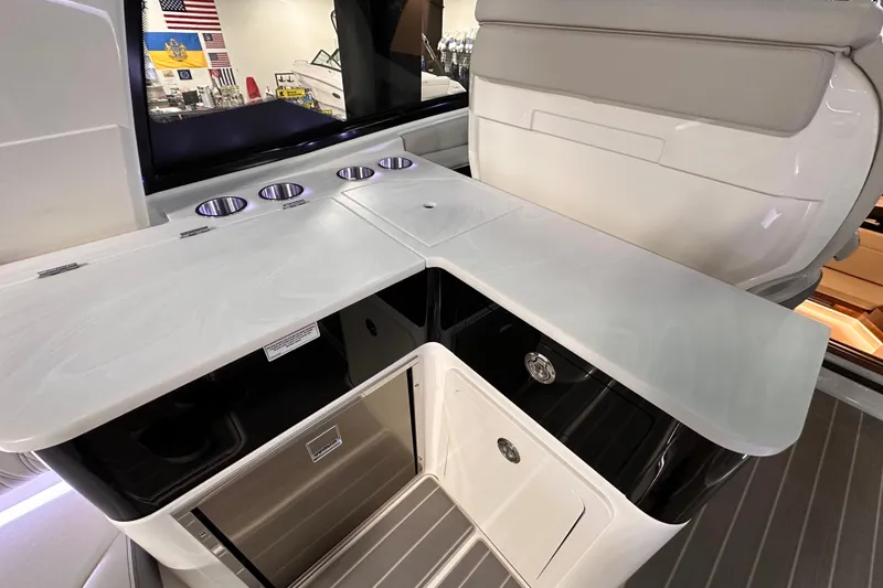 Slide: The Image of 2023 Sea Ray Sundancer 370 Outboard interior with sleek countertop and storage. - 12