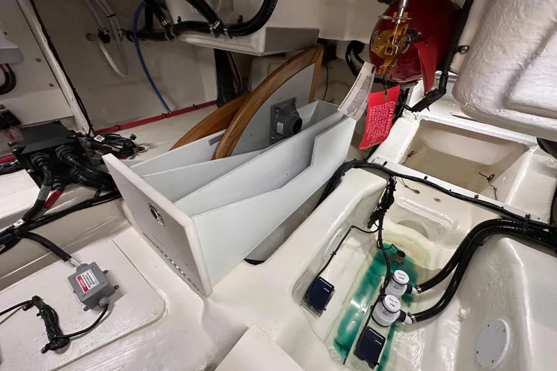 Slide: The Image of 2023 Sea Ray Sundancer 370 Outboard engine compartment with wiring and components. - 18