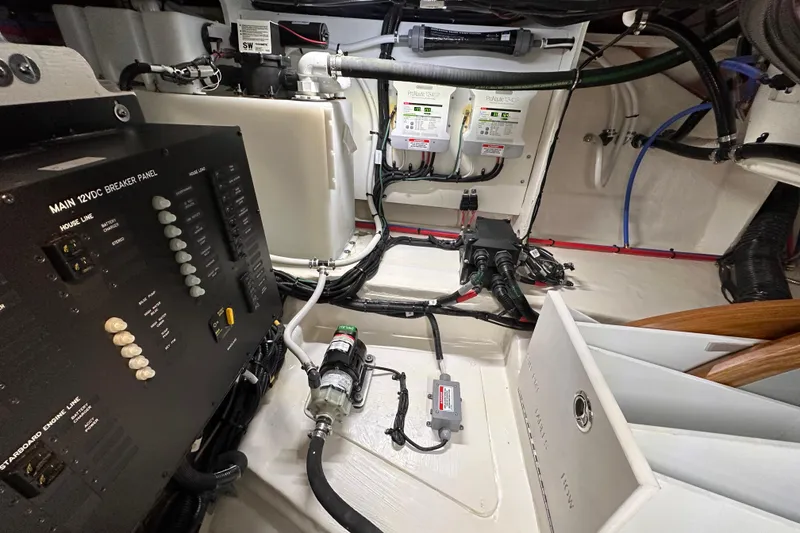 Slide: The Image of Electrical system of 2023 Sea Ray Sundancer 370 Outboard, featuring breaker panel and wiring. - 19