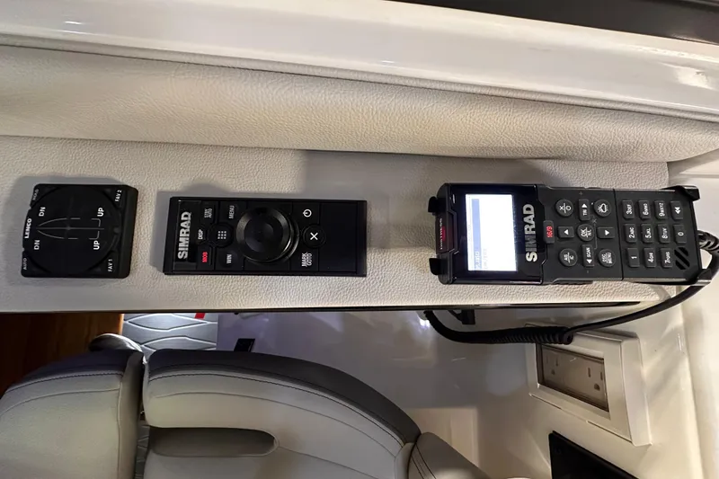 Slide: The Image of 2023 Sea Ray Sundancer 370 Outboard control panel with Simrad marine electronics. - 25