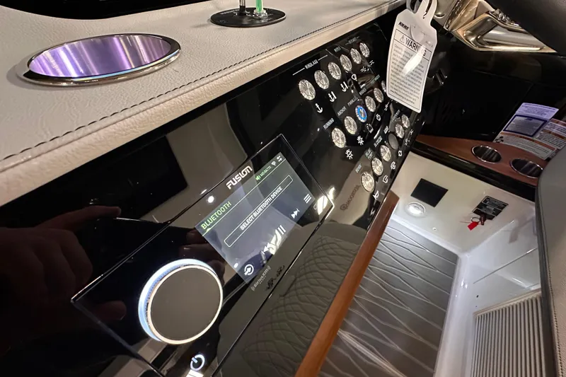 Slide: The Image of Control panel of 2023 Sea Ray Sundancer 370 Outboard with Bluetooth display and switches. - 27