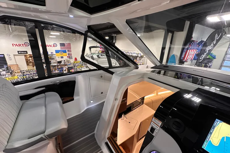 Slide: The Image of 2023 Sea Ray Sundancer 370 Outboard interior with modern helm and seating. - 30