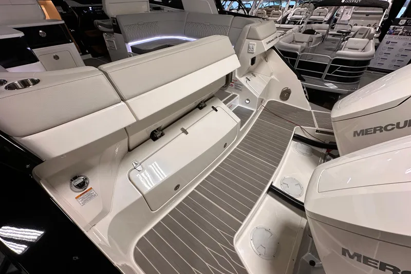 Slide: The Image of 2023 Sea Ray Sundancer 370 Outboard interior with seating and Mercury engines. - 7