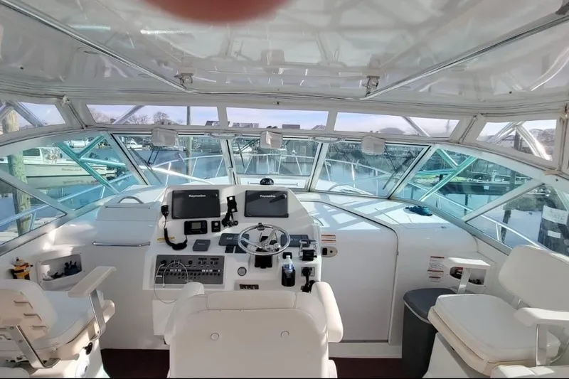 Slide: The Image of Interior view of 2011 Rampage 41 Express boat cockpit with navigation equipment. - 5