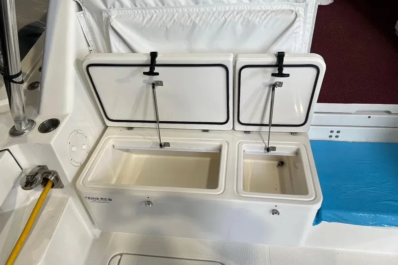 Slide: The Image of 2011 Rampage 41 Express boat with open storage compartments on deck. - 7